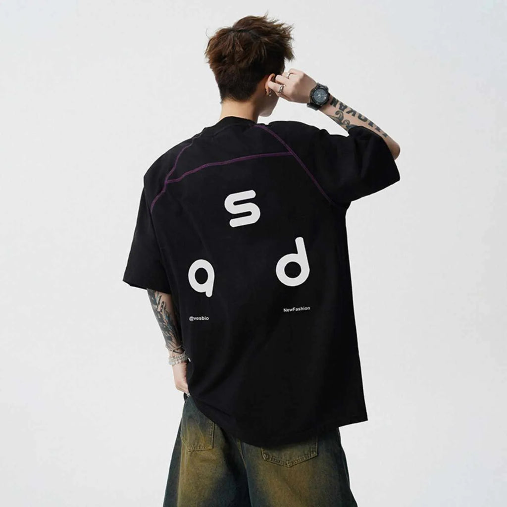 Man wearing a black loose-fit cotton short-sleeve T-shirt with a round neck collar.