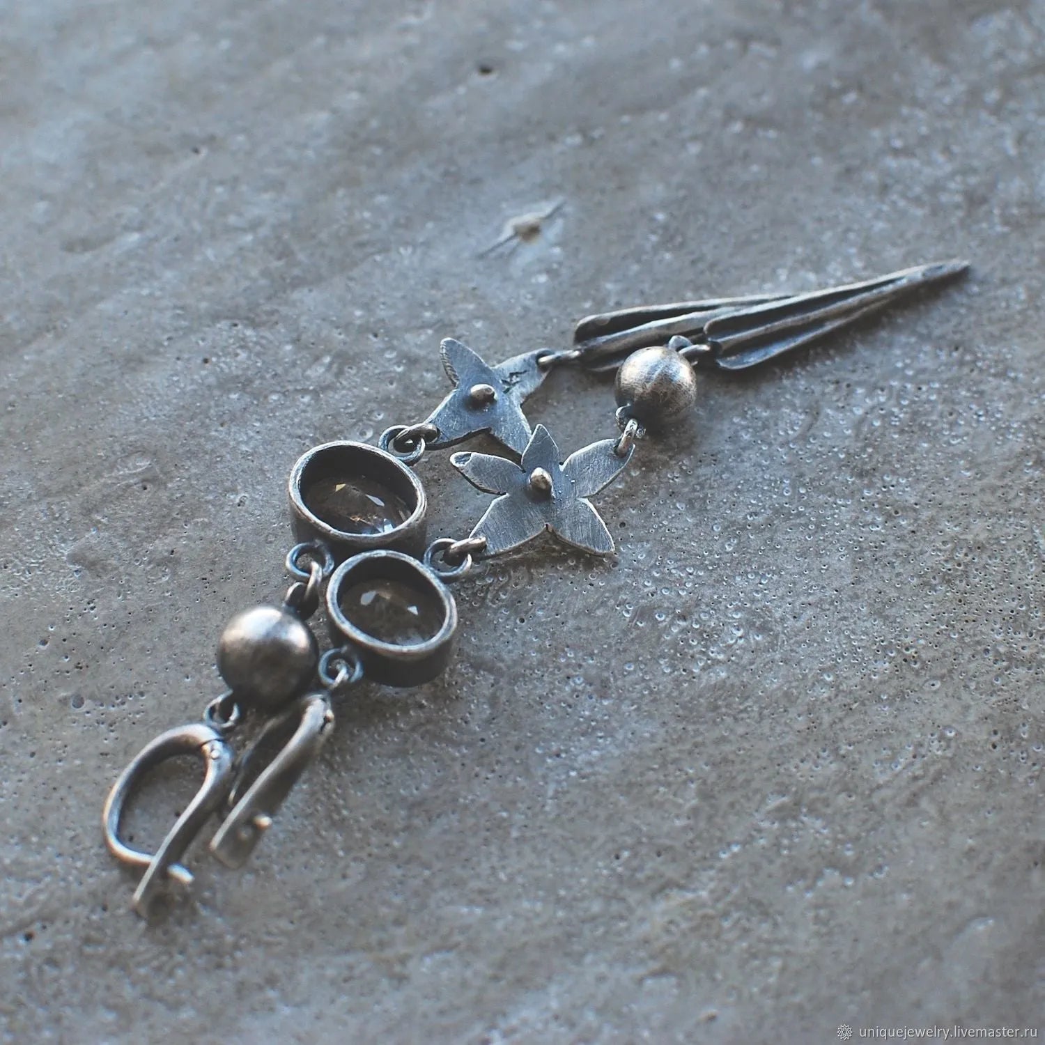 Geometric XINGX pendant earrings with antique silver plating and rhinestone details