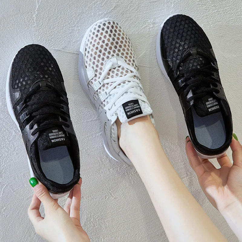 Low-top mesh sneakers in white with a hollow-out EVA sole design on a solid colour background.