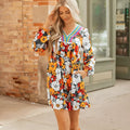 Orange floral print striped lace V-neck long sleeve mini dress on mannequin