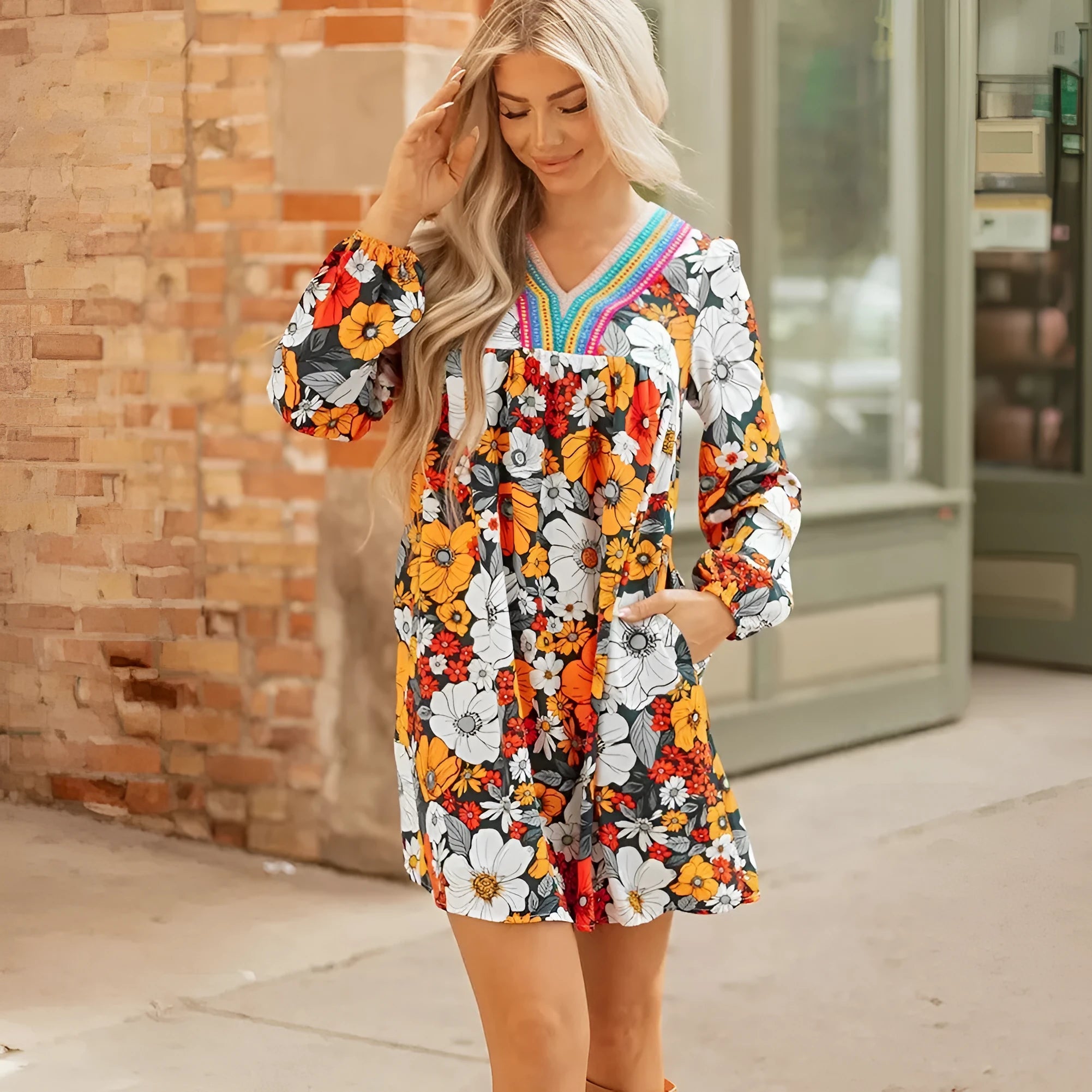 Orange floral print striped lace V-neck long sleeve mini dress on mannequin