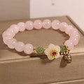 Crystal Hetian jade beaded bracelet with polished fruit shape beads and camellia element in blessing card colour