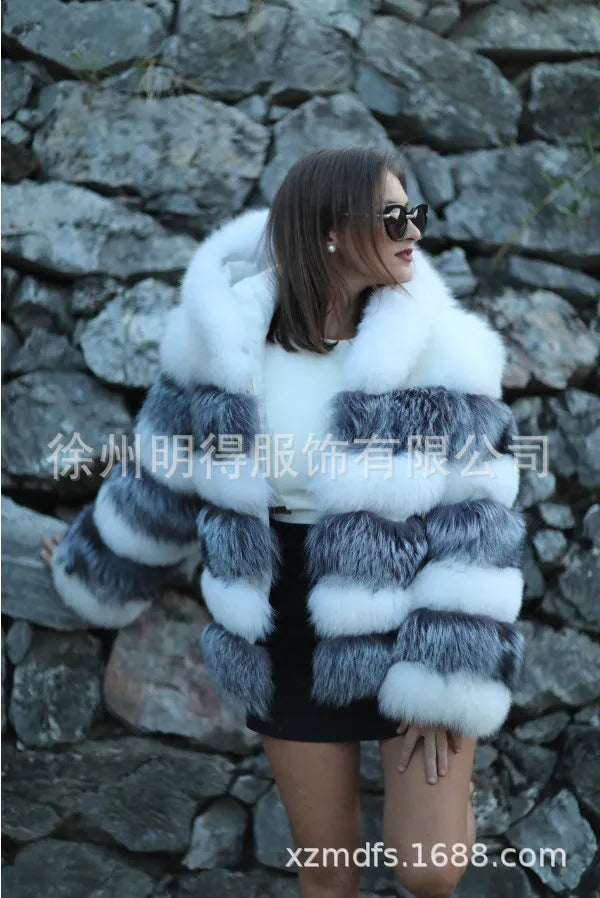 Women's loose faux fur hooded coat in street style, shown in medium length