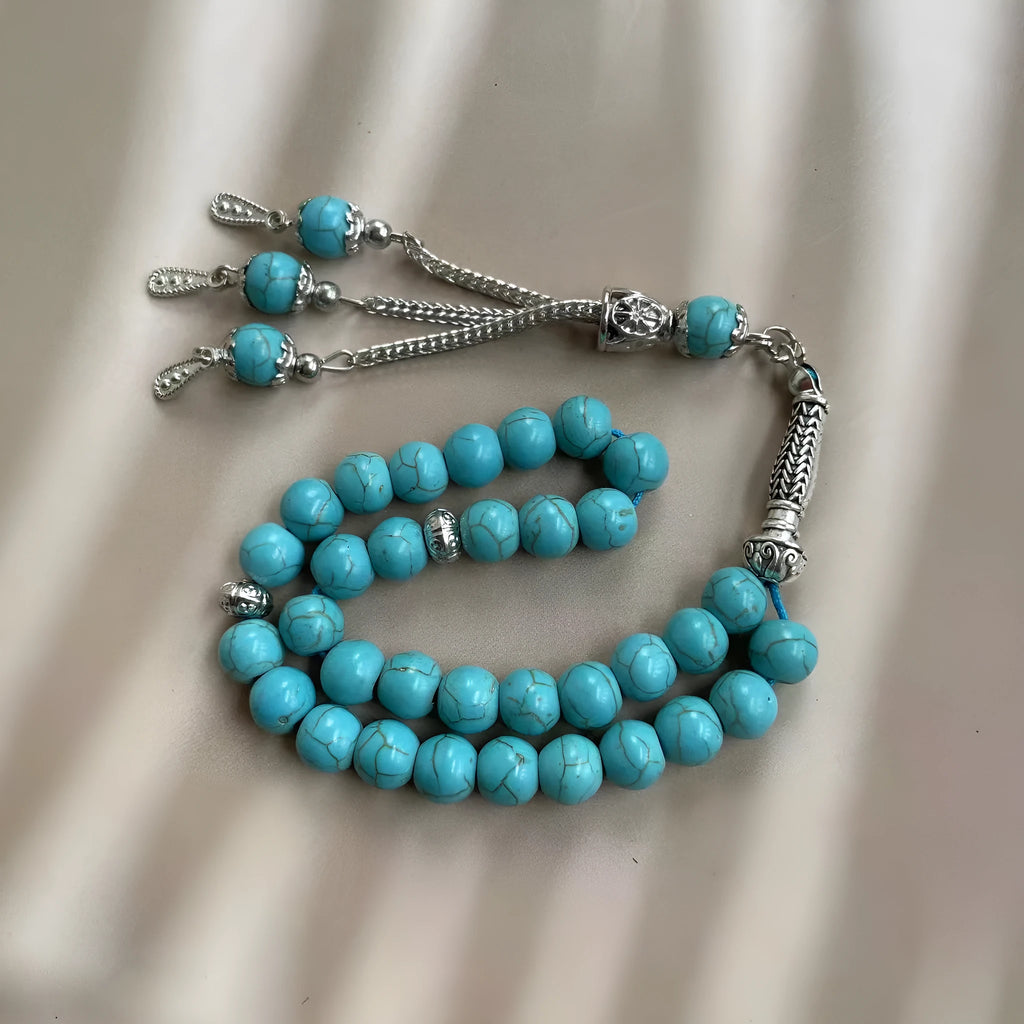 Handmade sky blue stone Muslim prayer bracelet with 8mm beads on a string.