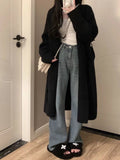 Women's mid-length knitted cardigan with V-neck and long sleeves in loose fit