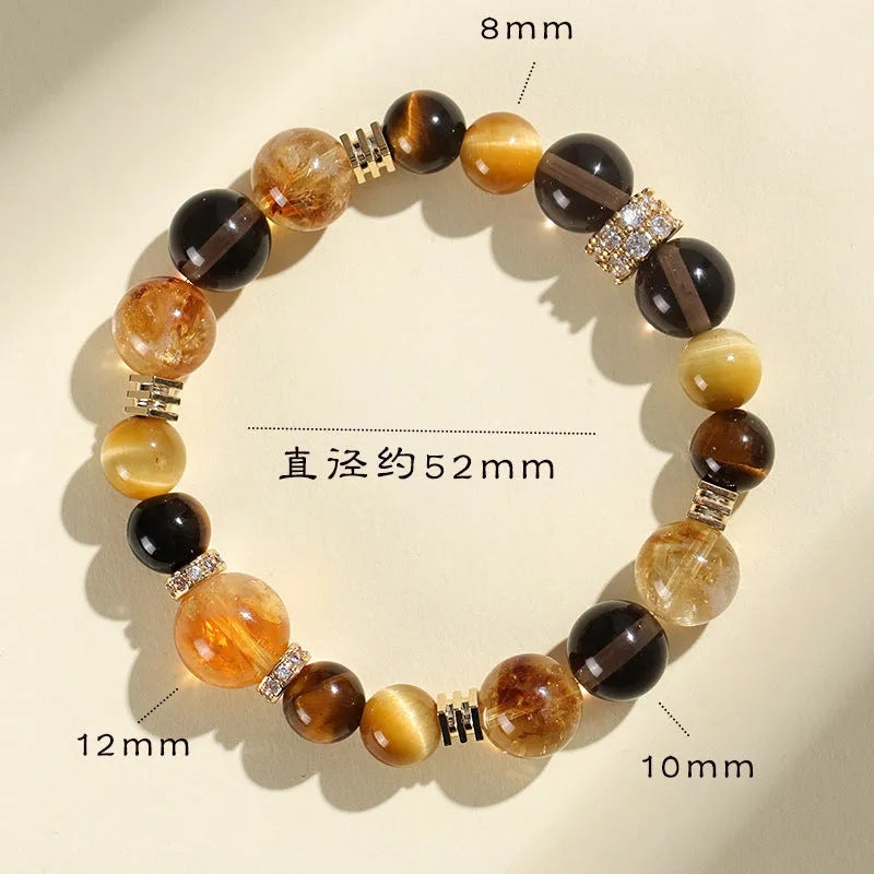 Close-up of a women's bracelet with yellow tower-shaped artificial crystal beads on a string.