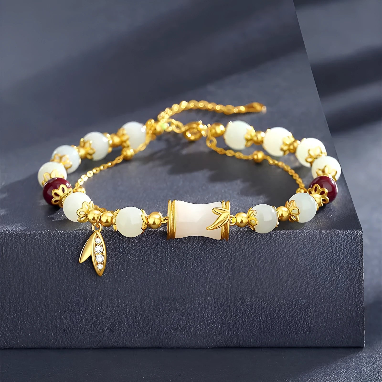 Bamboo special-design glass bracelet in beige with flower shape and Ruyi element, electroplated finish