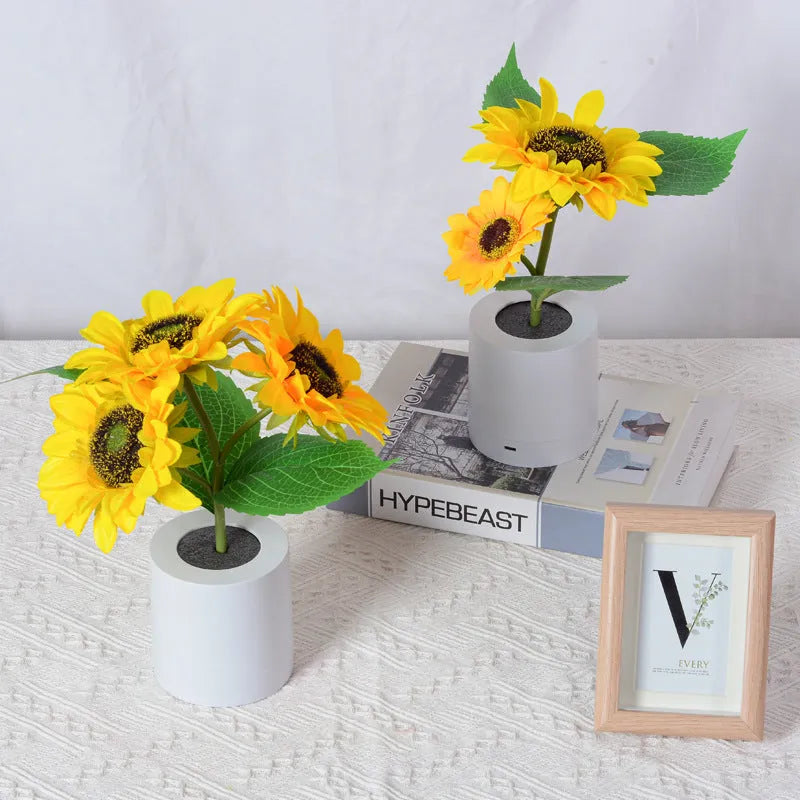 Rechargeable sunflower LED simulation night light with warm glow on a table