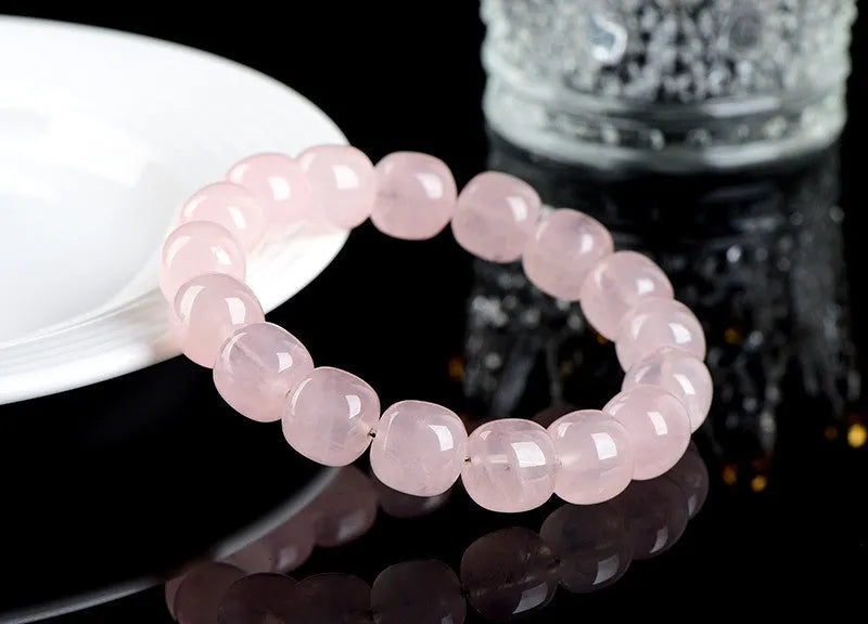 Pink crystal barrel bead bracelet with 11x12mm geometric beads and grinding treatment