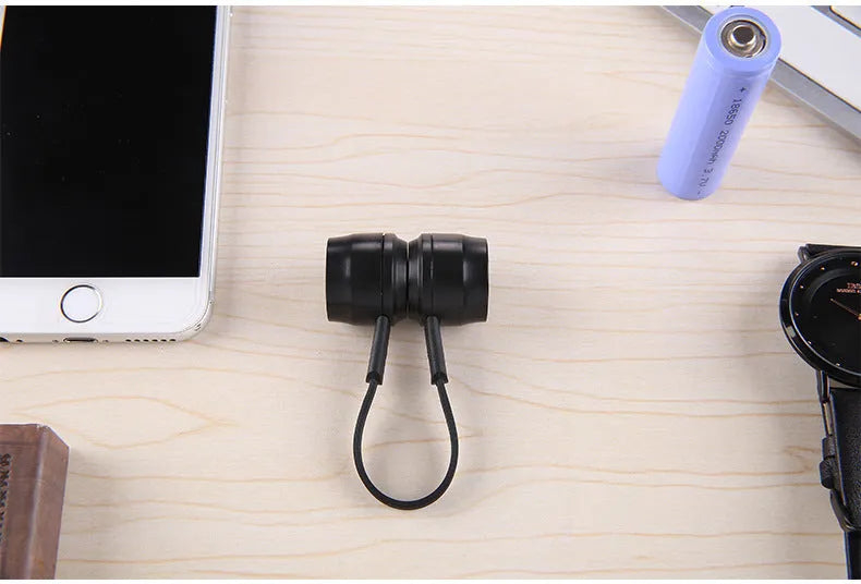 Mini portable keychain charger for mobile phone with 18650 battery slot and built-in charging cable