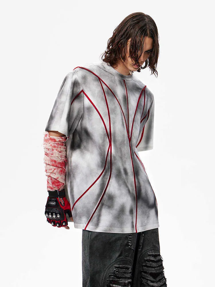 Padded shoulder T-shirt with textured line patchwork design on front