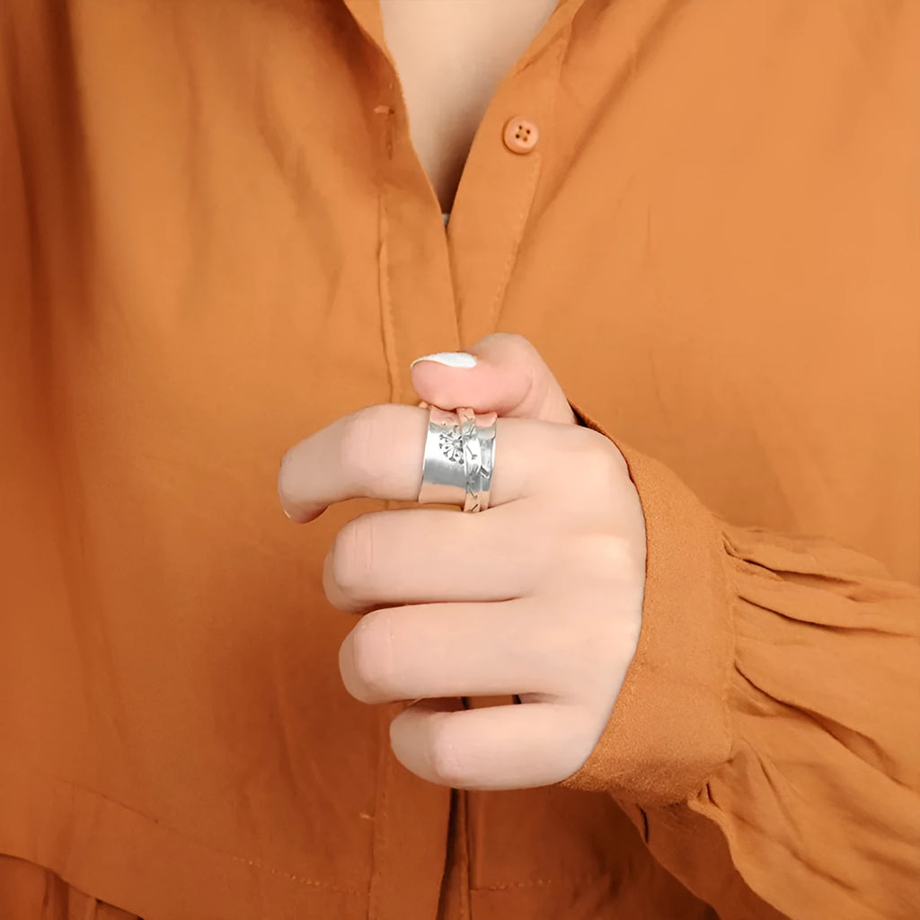 Silver electroplated alloy flower ring with rotatable design on finger