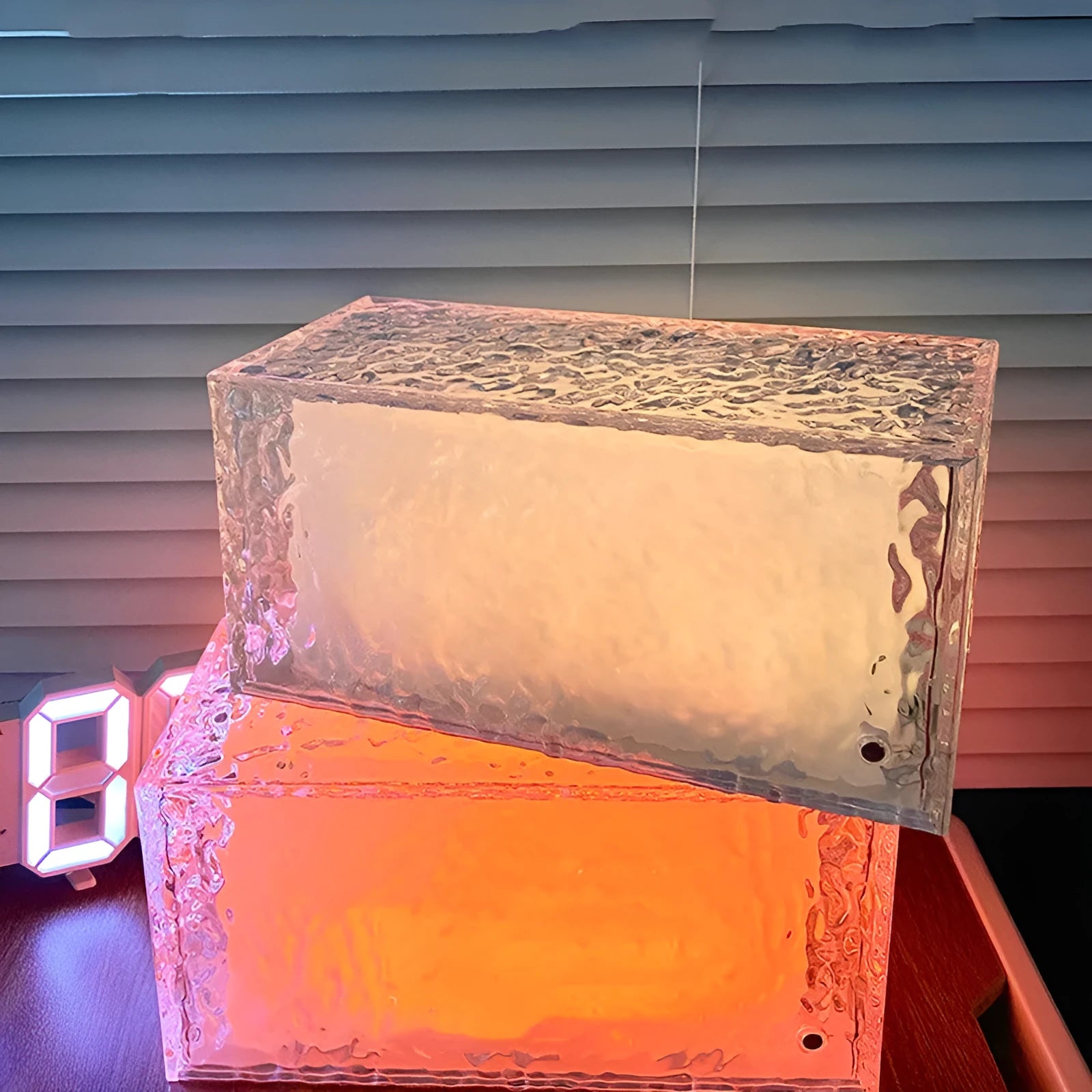 Clear acrylic geometric ice cube shaped night lamp with colour-changing LED lights.
