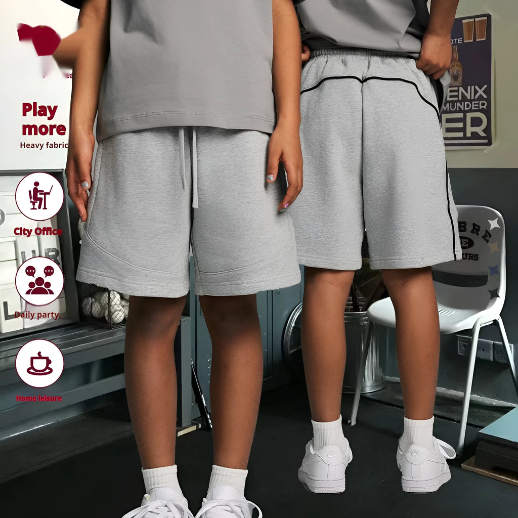 Solid colour loose cotton children's sports shorts in black, navy blue, mixed grey, and brown