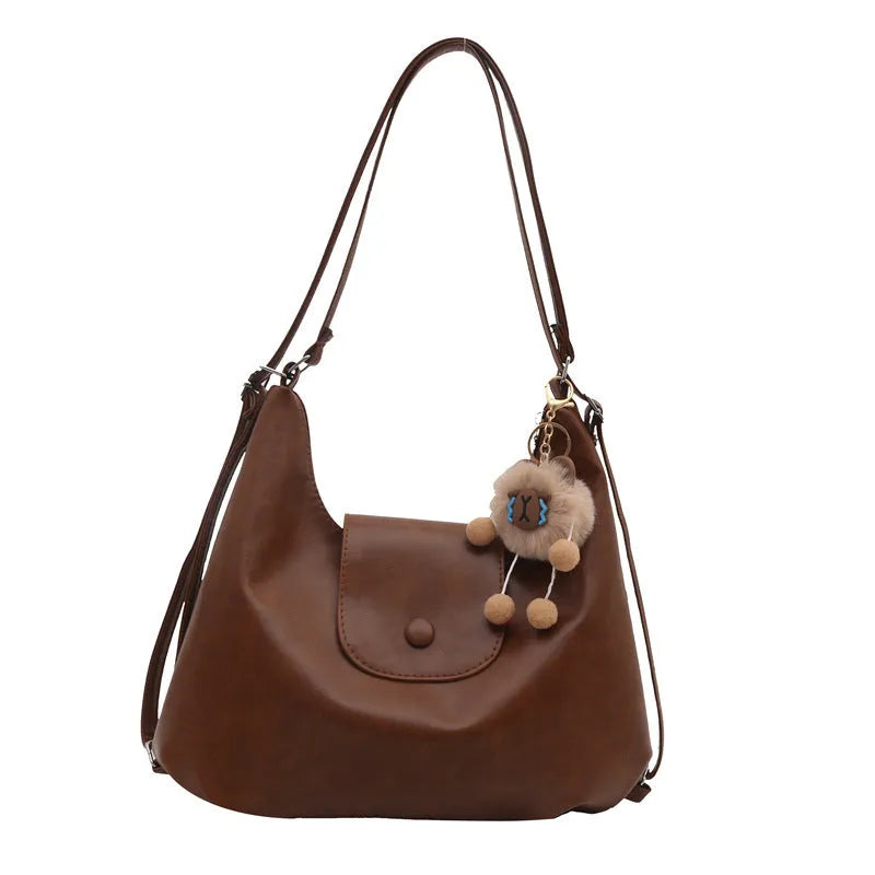 Women's PU leather single shoulder bag in horizontal square shape with optional pendant