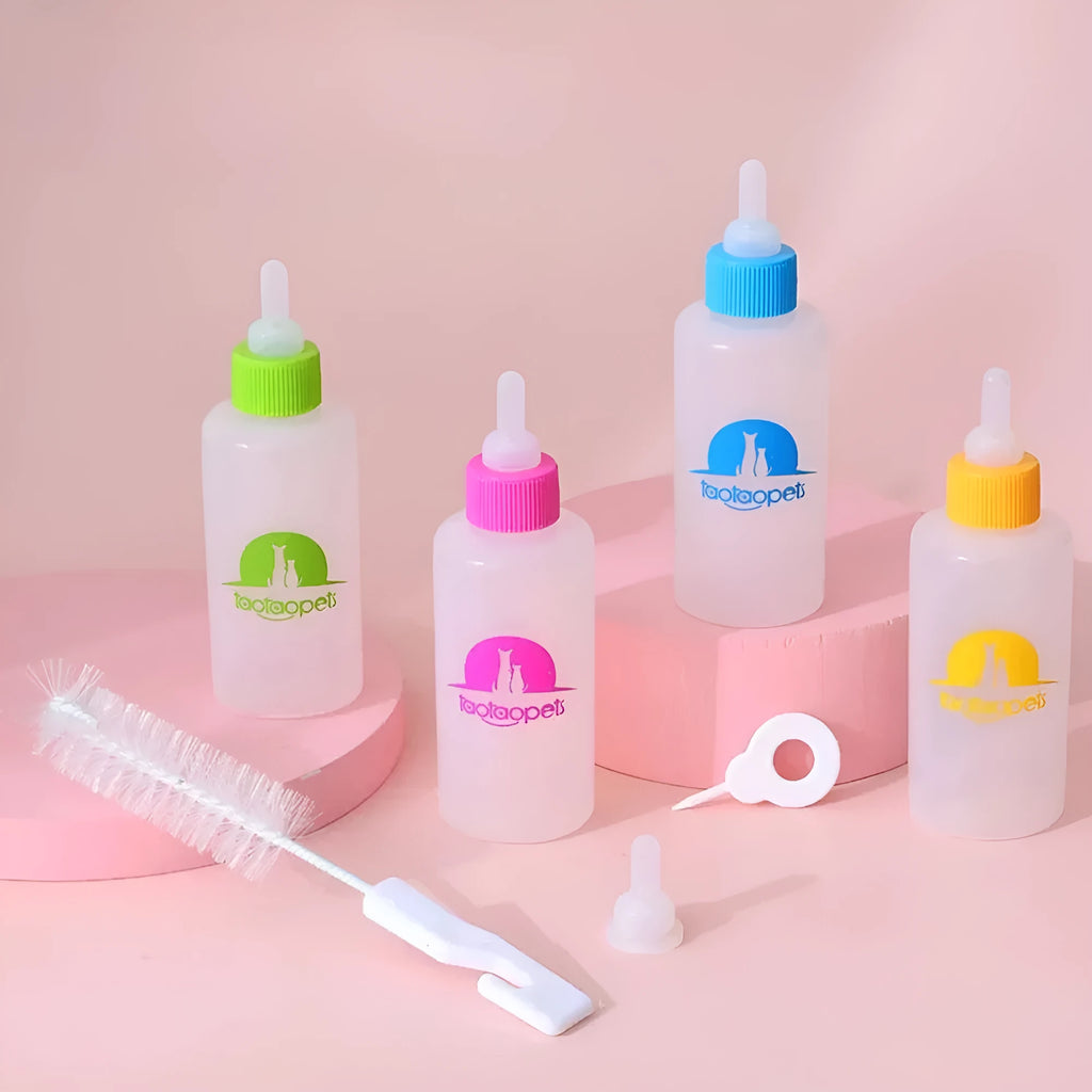 Four pet milk bottles in yellow, pink, blue, and green with cleaning brush on light background