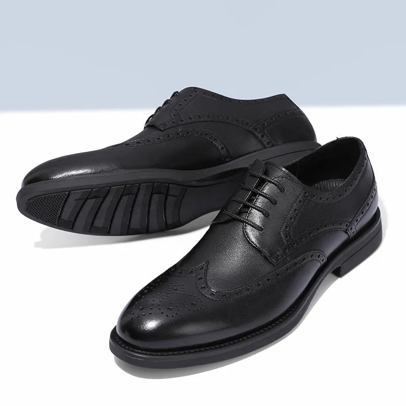 Men's black brogue leather shoes with traditional perforated toe design on business styling
