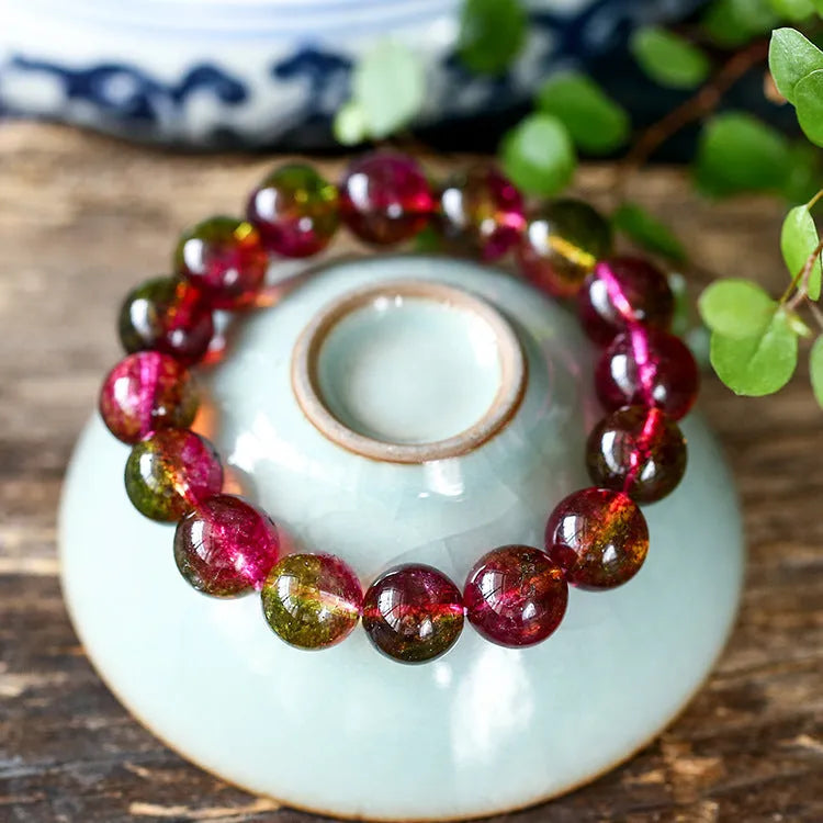 Watermelon crystal bracelet showing pastoral design on female wrist