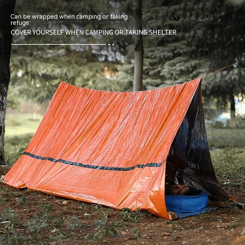 Orange portable disaster relief tent shown with optional sleeping bag and emergency blanket for outdoor use.