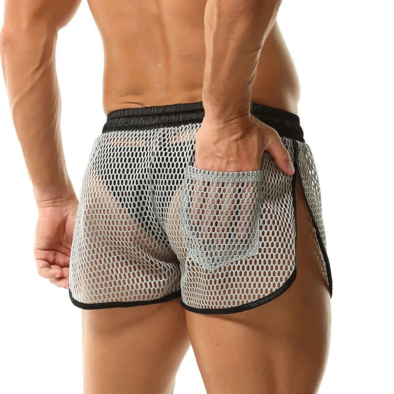 Men's loose breathable polyester boxers in solid colour black, front view on white background