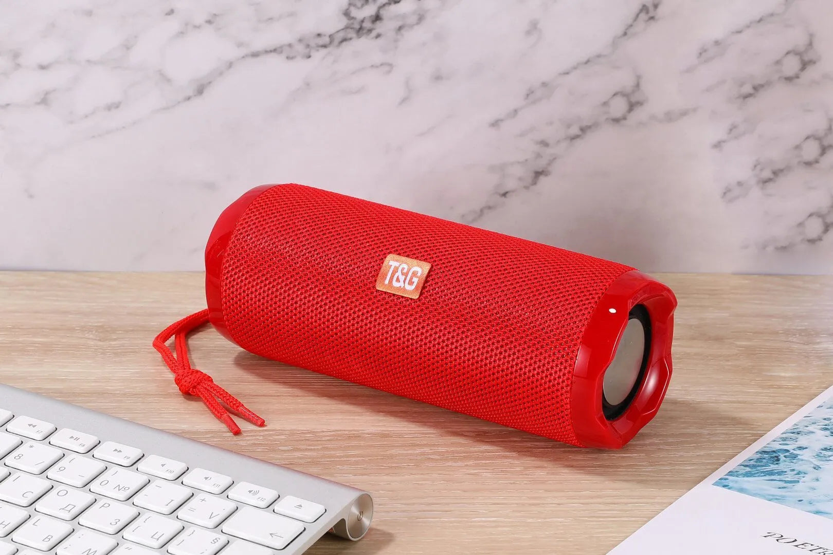 Fabric-covered portable Bluetooth speaker with integrated card holder in multiple colour options