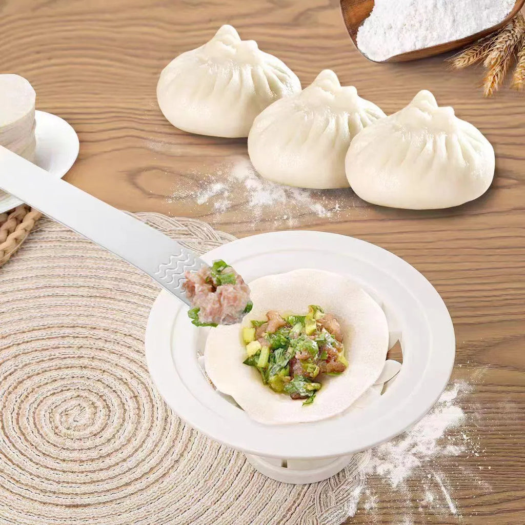 Set of four black stainless steel steamed bun moulds for shaping baozi and dumplings