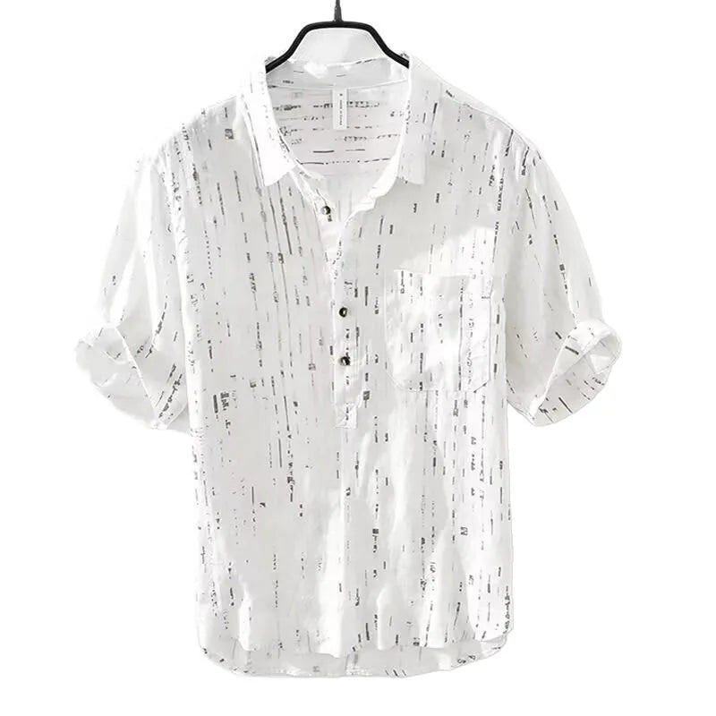 Men's loose fit short sleeve lapel polo shirt in black or white, shown on a hanger.