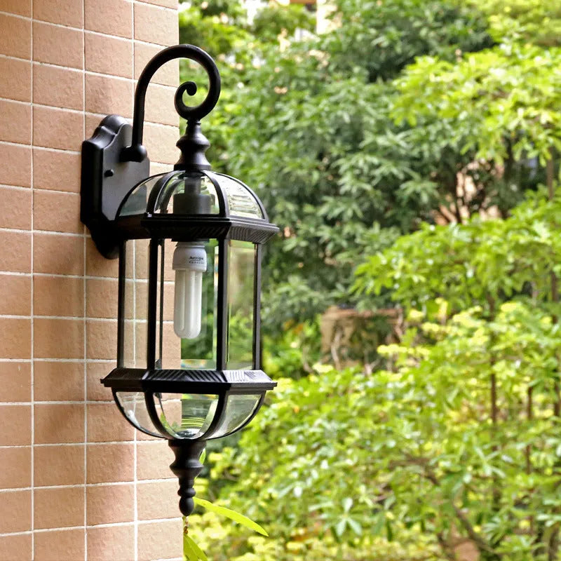 Gold aluminium outdoor waterproof wall lamp with three-layer eight-inch design on brick wall, courtyard setting