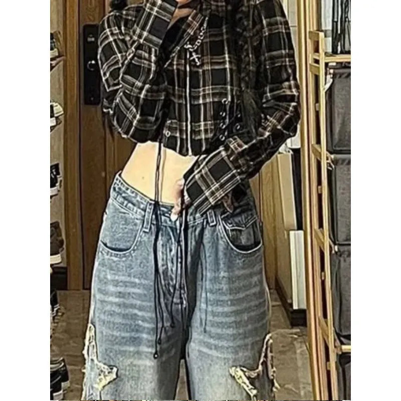 Blue high-waist women's jeans with a wide-leg straight cut on a mannequin.
