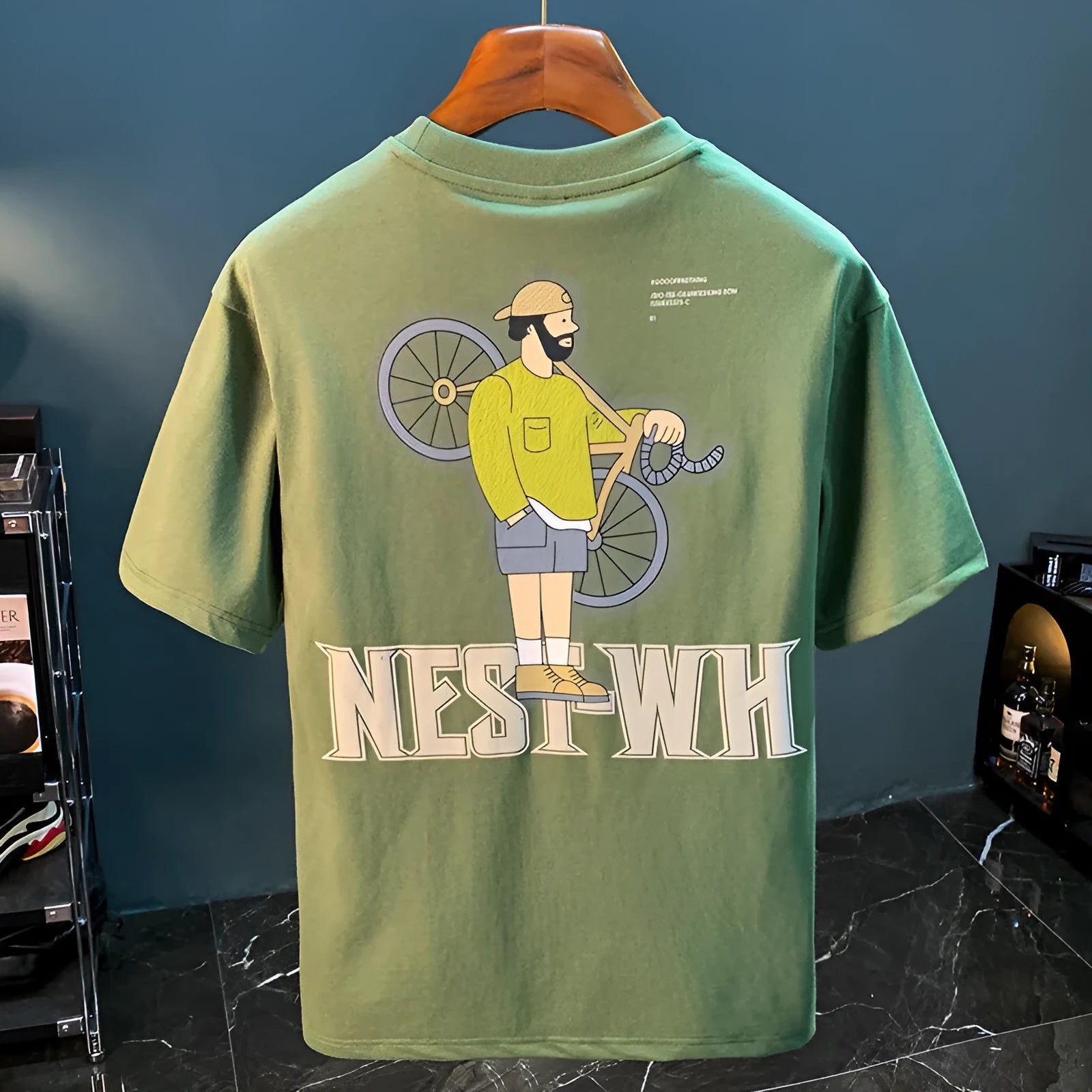 Green men's loose fit T-shirt with a literary print on the front, short sleeves.