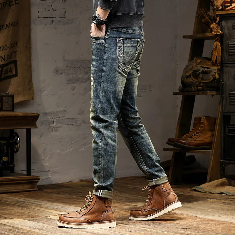 Men's skinny fit jeans in a retro blue denim wash with a zip fly closure.