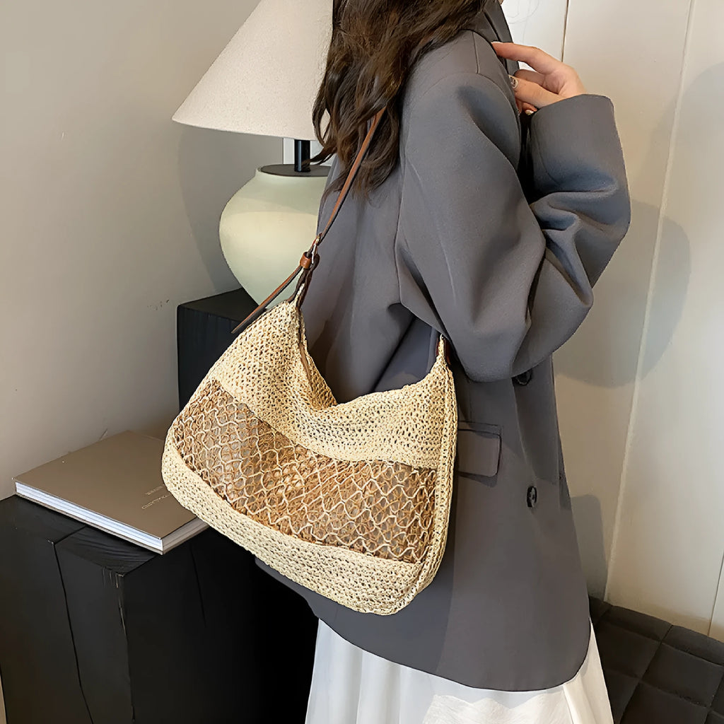 Women's straw cross body bag in khaki colour showing horizontal square shape and sandwich pocket design