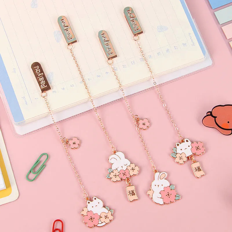 Creative cartoon metal pendant bookmark with cute cherry cat design in sakura style on white background
