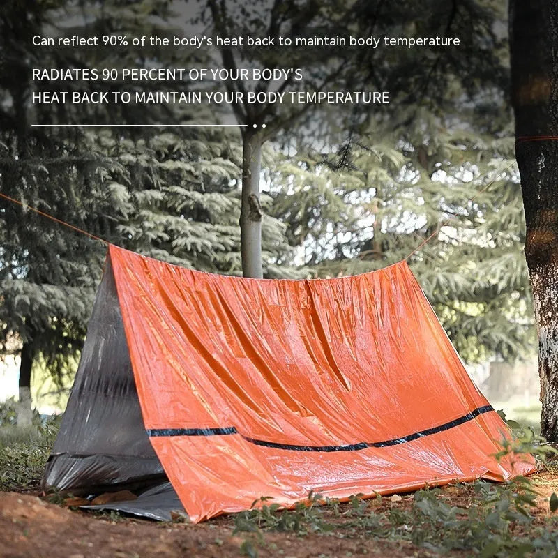 Orange portable disaster relief tent shown with optional sleeping bag and emergency blanket for outdoor use.