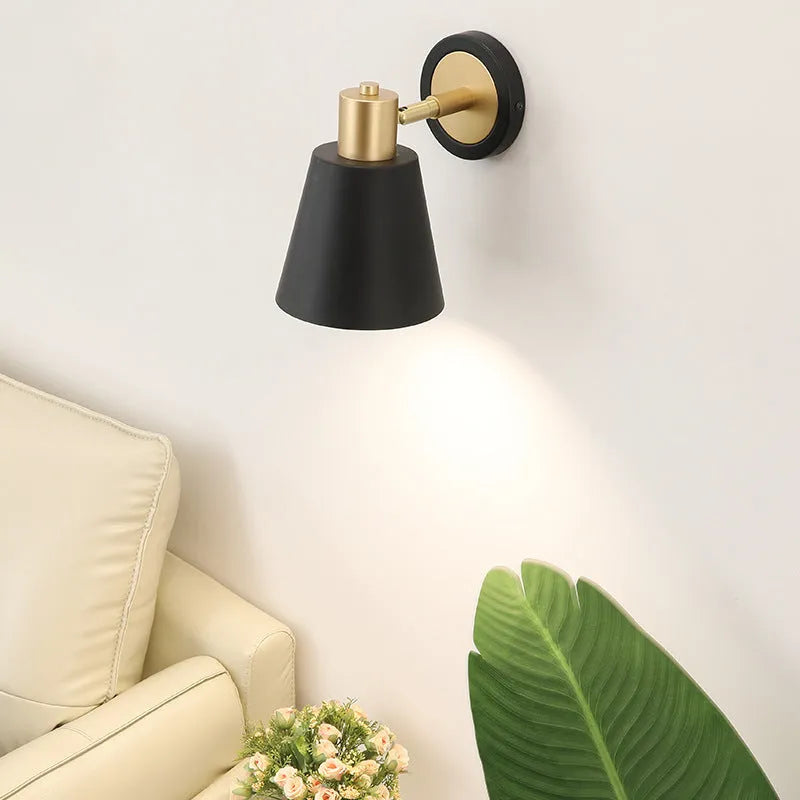 Nordic style iron wall lamp in one of four style variations for bedside or sofa lighting.