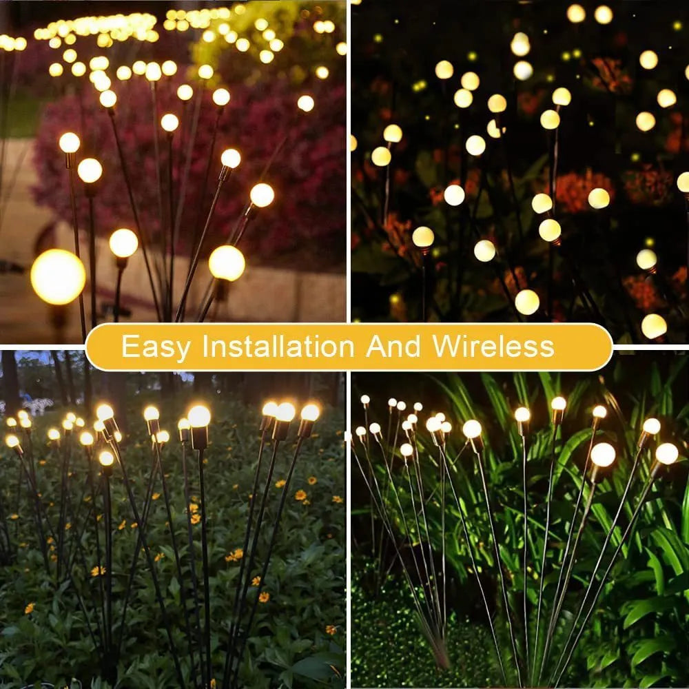 Set of solar-powered LED garden spike lights with multiple heads on stainless steel stakes for lawn or pathway.