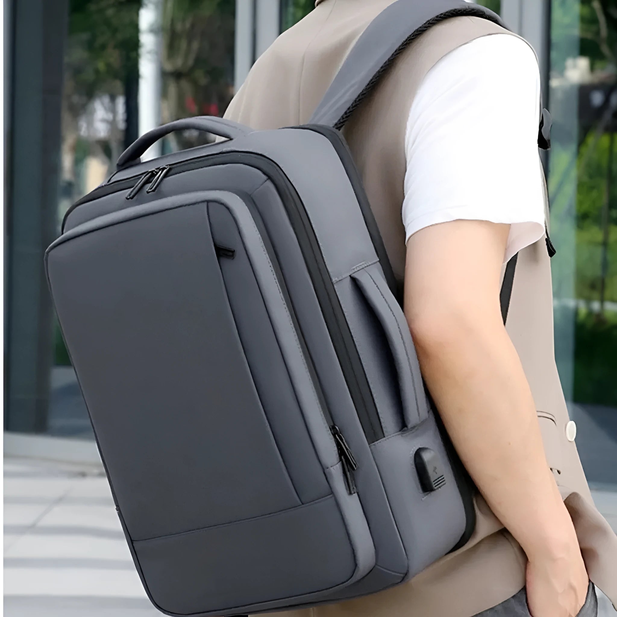 Large capacity black backpack for business travel and outdoor use with curved shoulder straps