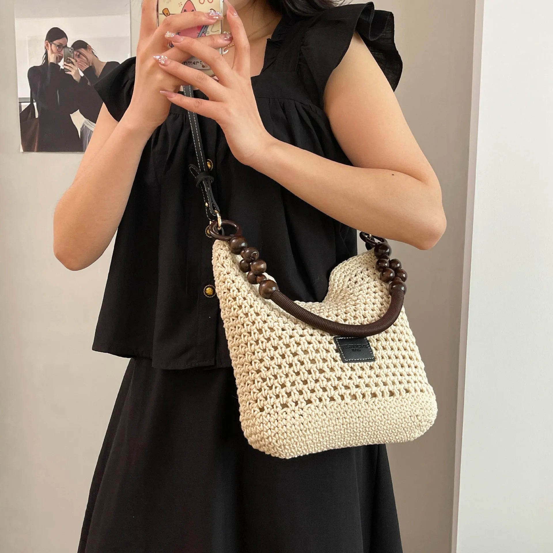 Large capacity knitted tote beach bag in brown with contrast stitching, bucket shape, crossbody strap, and zipped internal compartment