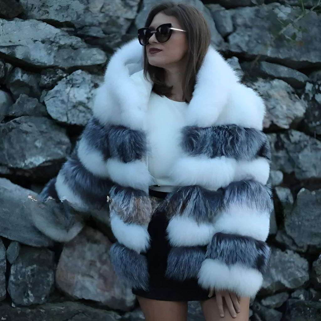 Women's loose faux fur hooded coat in street style, shown in medium length