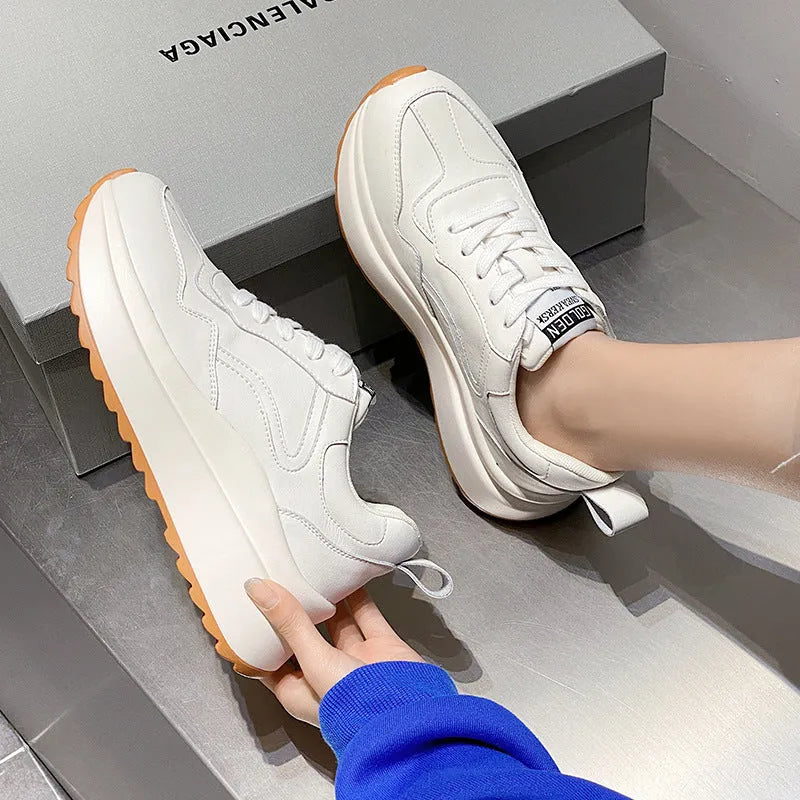 Beige women's low-top leather casual shoes with cross strap and English muffin heel on a white background.