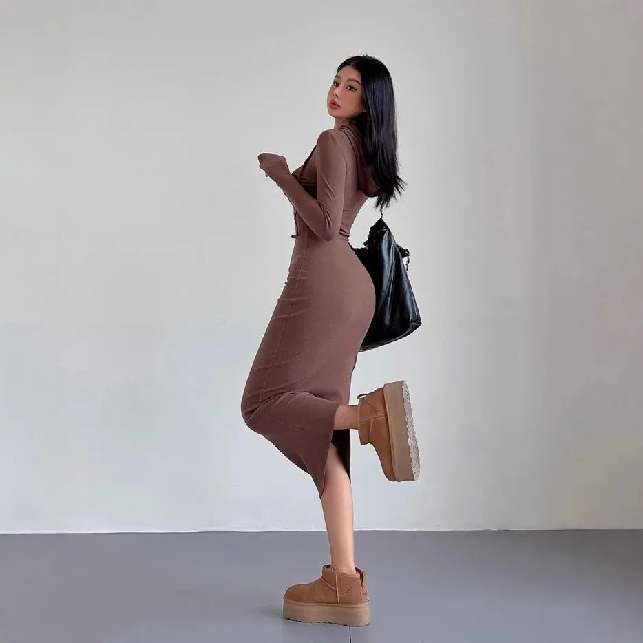 Women's grey hooded long-sleeve sheath dress with a high waist on a model