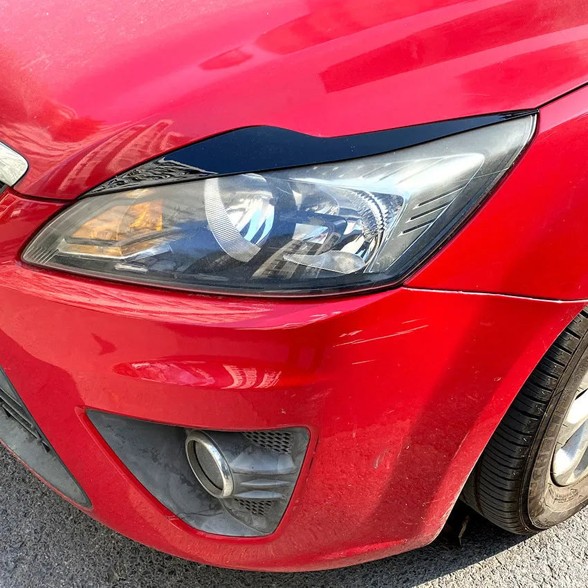 Ford Focus front headlight with carbon fibre pattern ABS eyelid sticker trim applied