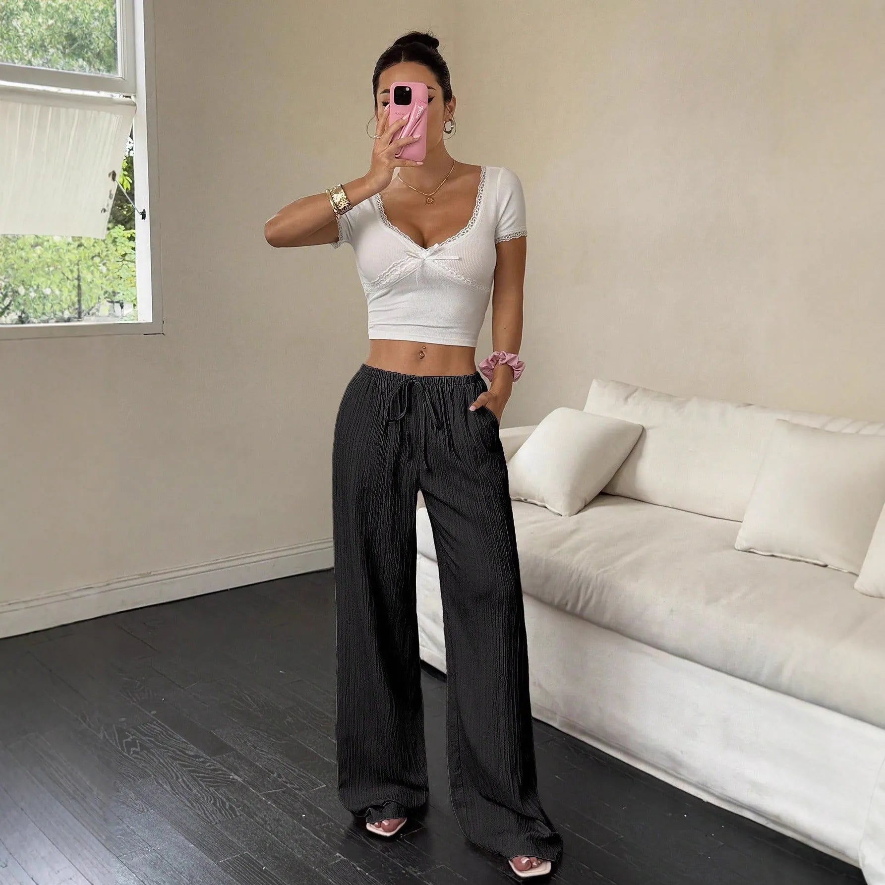 Women's black wide-leg trousers with lace-up waist detail on mid waist