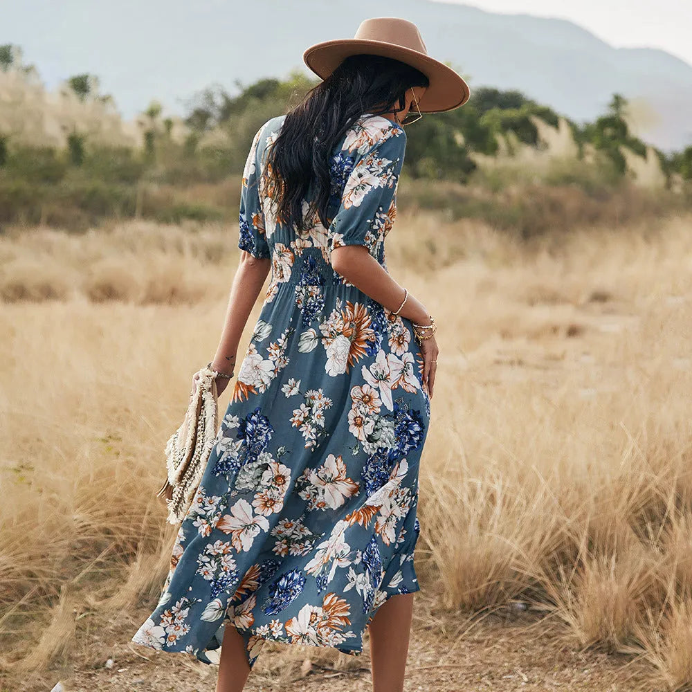 Yellow floral summer dress with V neck and elastic waist on mannequin