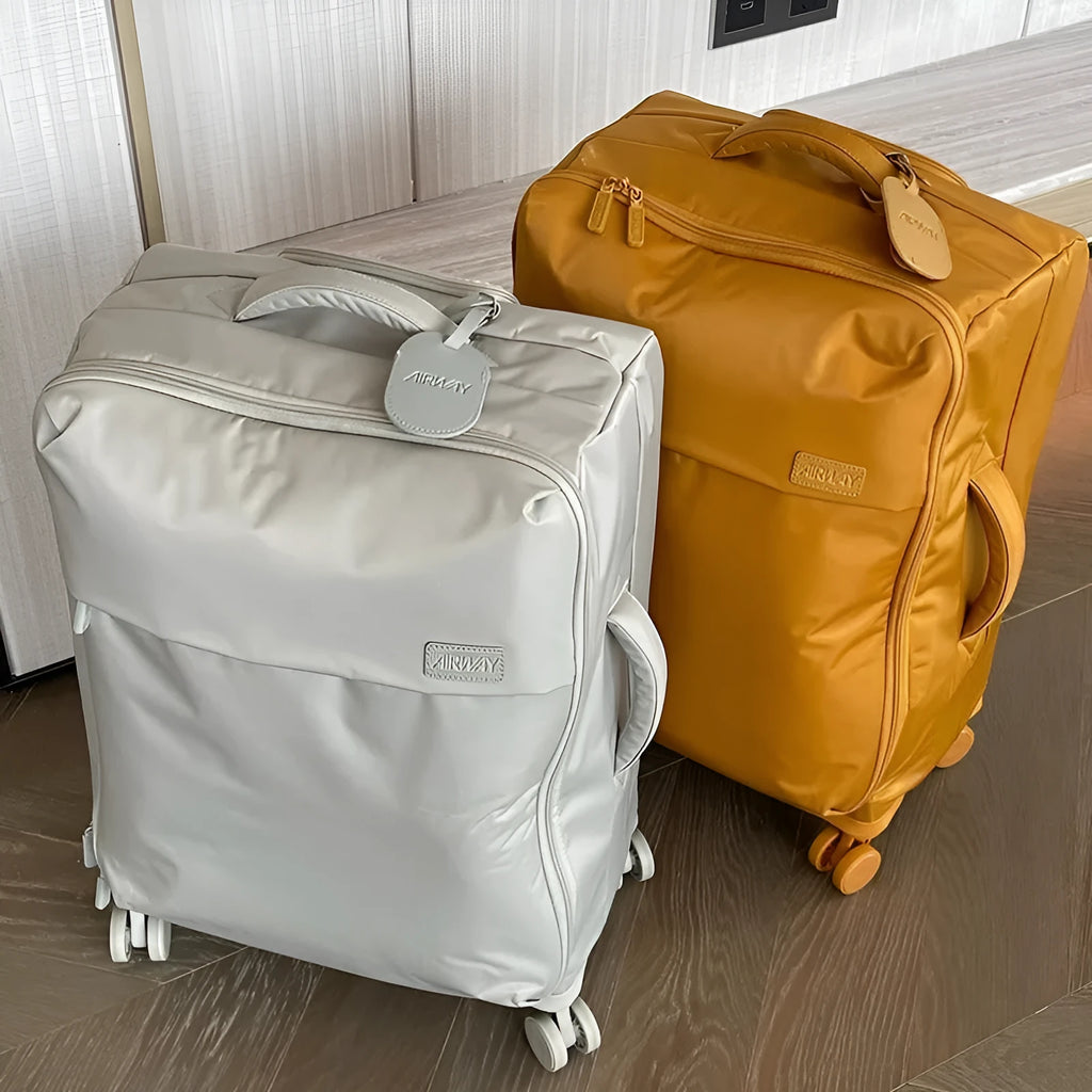 Ultra-light waterproof Oxford cloth suitcase in bluestone green with universal wheels.