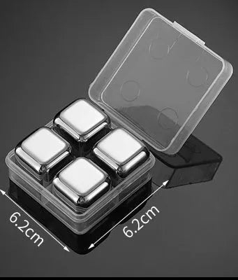 Set of 8 stainless steel ice cubes in square and ball shapes with plastic storage box and tong on a wooden surface