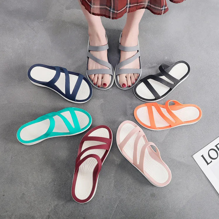 Women's solid colour casual sandals on a beach background, showing red, blue, and black colour options.