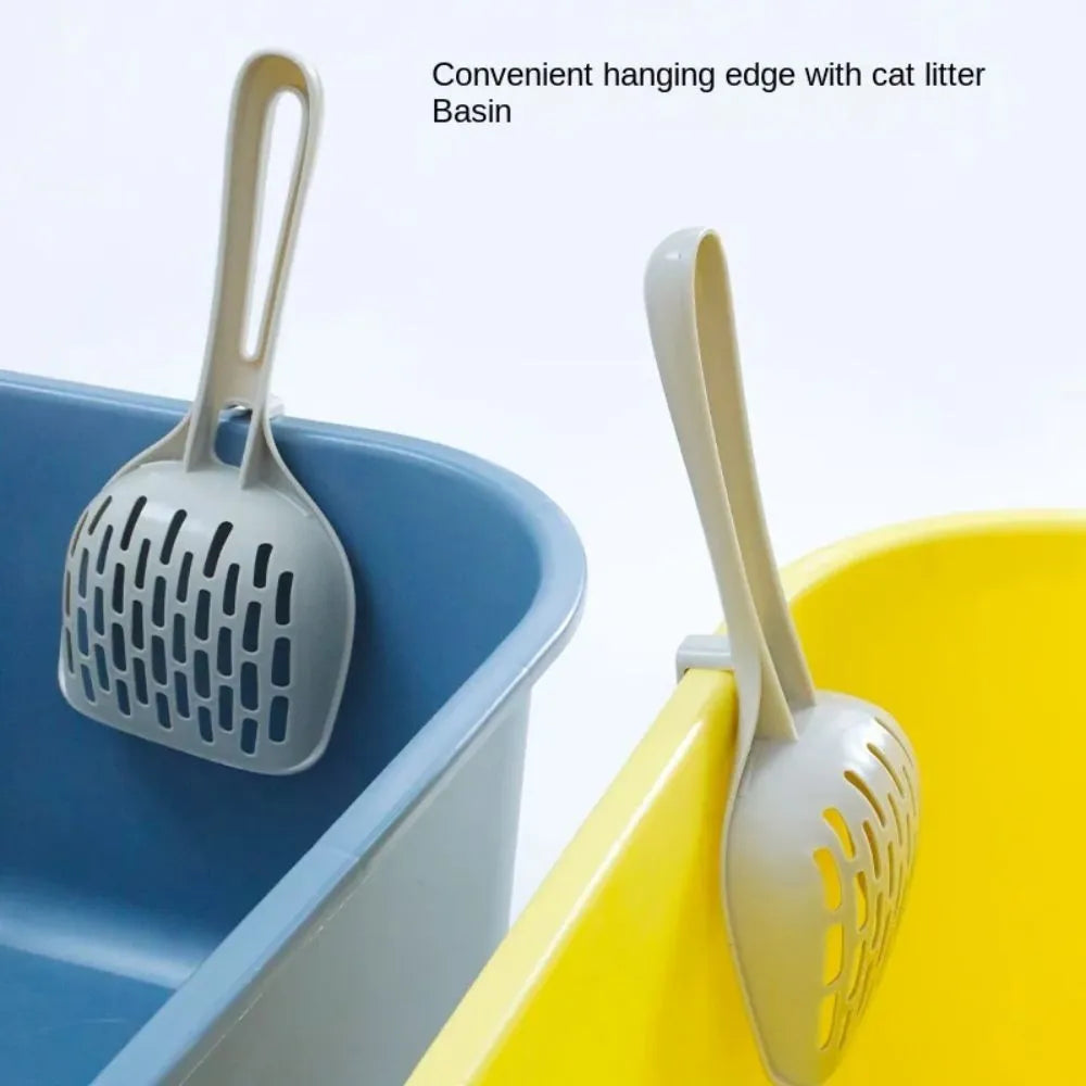Gray plastic cat litter scoop with matching base for self-cleaning kitten toilet maintenance