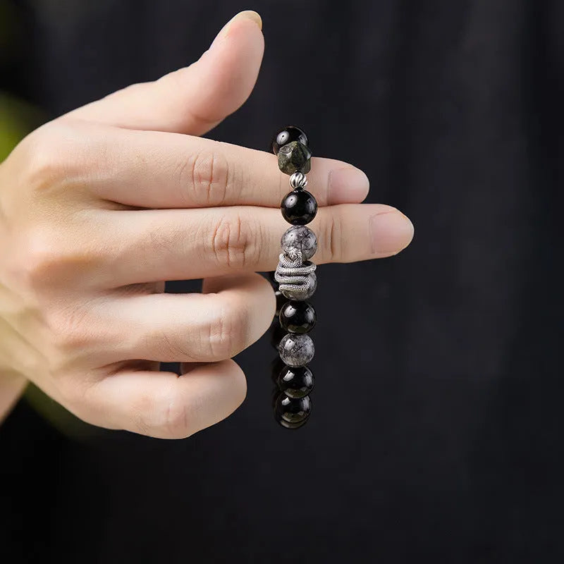 Men's black obsidian snake bracelet in sterling silver with retro zodiac design
