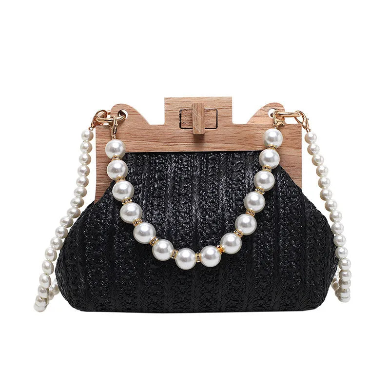 Women's woven straw shoulder bag with pearl chain detailing and multiple interior compartments